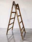 A mid-20th century pine stepladder, with metal fittings, height 232 cm.