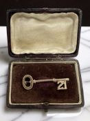A 9ct gold 21st Birthday key brooch, length 4cm.