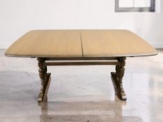 An Ercol stained elm extending dining table with internal leaf, unextended 160 cm x 103 cm x 74 cm.