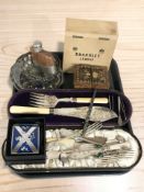 A cased EPNS carving set and other cutlery, Scottish themed belt buckle, hip flask,