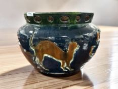A late Victorian earthenware jardiniere decorated with various animals, diameter 30 cm.