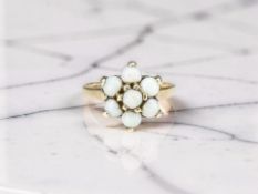 A 9ct gold opal cluster ring, size M CONDITION REPORT: 2.