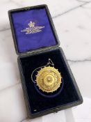 A Victorian Etruscan Revival yellow metal memorial brooch, stamped 15ct, diameter 3.