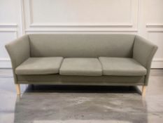 A late 20th century Scandinavian Nielaus three seater settee, in grey fabric upholstery,