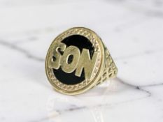 A 9ct gold and black onyx 'Son' signet ring, size S CONDITION REPORT: 5.