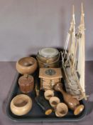 A wooden model of a yacht, various other treen including egg cups, lidded pot, biscuit barrel,