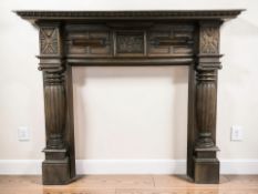 A Victorian style carved and stained hardwood fire surround, width 153 cm.