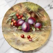 A Royal Worcester porcelain cabinet plate, hand-painted with panels of fruit by Harry Ayrton,