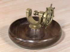 A brass and turned wooden nutcracker bowl, diameter 21 cm.