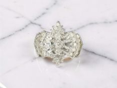 A white gold diamond cluster ring, the stated total diamond weight 1.