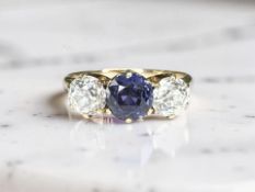 An antique three-stone sapphire and old-cut diamond ring, size L CONDITION REPORT: 2.