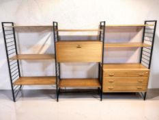 A 1970's Ladderax teak and metal shelving system, overall 280 cm x 42 cm x 163 cm.