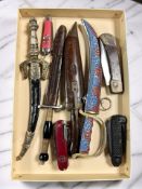 A group of letter knives, military clasp knife, Swiss army type knife, etc.