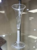A Georgian wine glass, circa 1750, the long trumpet bowl above an air twist stem, height 19cm.
