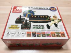 An Atari Flashback 9 retro-style games console, with 110 built-in games, in box with manual.