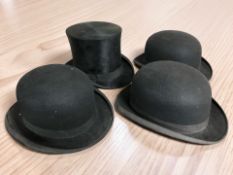 A gent's black silk top hat retailed by West End Style, London,