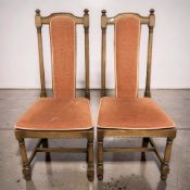 A pair of Ercol stained elm dining chairs.