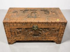 A Chinese carved camphorwood blanket chest, width 74 cm.