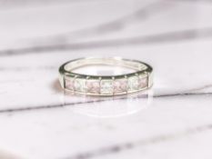 A 9ct white gold pink topaz and CZ half-eternity ring, size Q CONDITION REPORT: 2.
