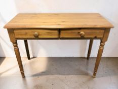 A 20th century pine two drawer hall table, width 104 cm.