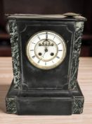 A Victorian black slate and marble mantel clock with visible escapement, with pendulum,