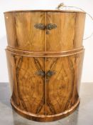 An Art Deco figured walnut bow front cocktail cabinet, 100 cm x 32 cm x 127 cm.