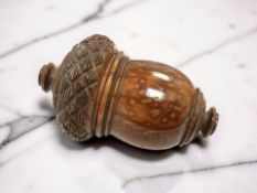 A treen carved coquila nut nutmeg grater,