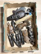 A group of African carved hardwood masks and busts.