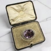 A Victorian synthetic amethyst and split pearl brooch,