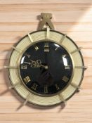 A 20th century German UPG Halle circular wall timepiece, diameter 25 cm.