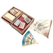 A Victorian inlaid walnut jewellery box, several hand fans, playing cards,