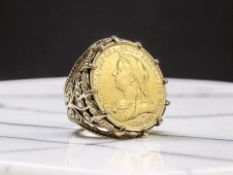 A 9ct gold signet ring inset with a Victorian full gold sovereign 1894,