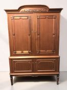 A contemporary teak double door cabinet with shelved interior, 114 cm x 48 cm x 171 cm.