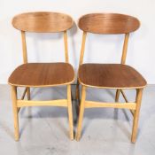 A pair of 20th century bent and laminated teak chairs.