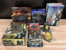 A group of toys and figurines including Mattel, Batman, Jaws, etc.