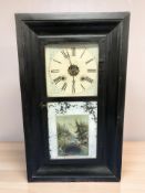 A 19th century continental ebonised wall clock, height 66 cm.