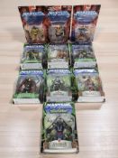 A group of Mattel Masters of the Universe figurines in packaging.