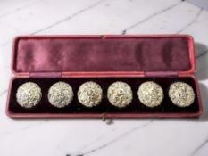 A set of six Art Nouveau silver buttons, Birmingham 1902, diameter 3cm, cased.