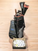 A Wilson golf bag containing irons and drivers, a box of golf balls and a Dunlop tennis racket.