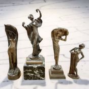 Four Art Nouveau bronze figures of ladies, tallest 17cm.