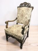 A continental carved beech open armchair, width 69 cm.