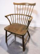 A continental beech spindle back Windsor-style open armchair, width 57 cm.