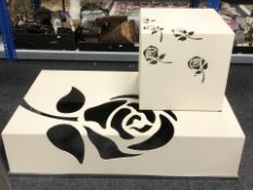 A contemporary hollow metal rectangular low coffee table decorated with a rose, length 122 cm,