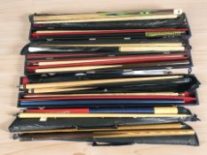 A group of snooker cues including Riley.