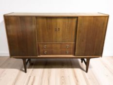 A 20th century Scandinavian beech and teak sliding door sideboard, 179 cm x 45 cm x 119 cm.