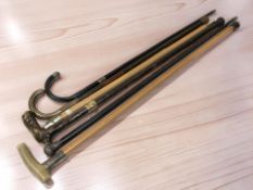 A group of walking canes and sticks including silver mounted examples.