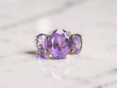 A 9ct gold amethyst and diamond dress ring, size M CONDITION REPORT: 3.