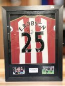 An Ethan Robson Sunderland AFC signed and dedicated football shirt, in frame.