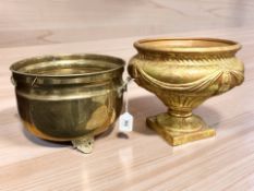 A brass twin handled planter, diameter 27 cm, and a further gilt metal pedestal planter.