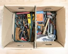 A collection of vintage and modern hand tools.